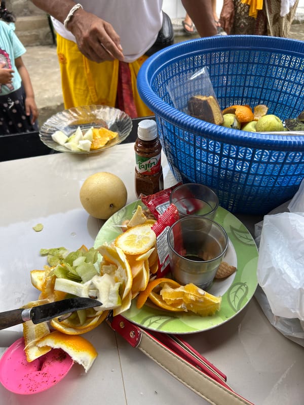 Food, offerings, and woven baskets at a Balinese gathering