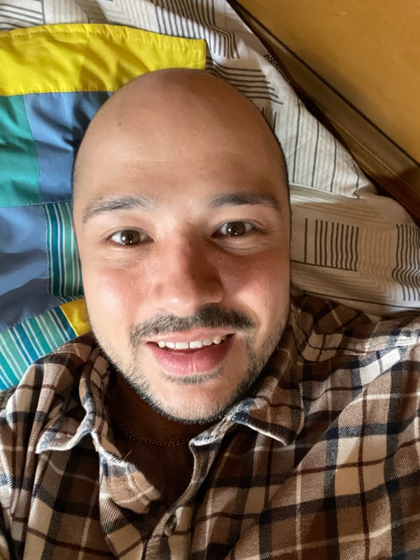 Man takes selfie on bed in Zav'yalovo, Russia