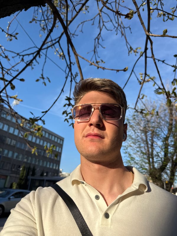 Man takes selfies on sunny Plovdiv sidewalk