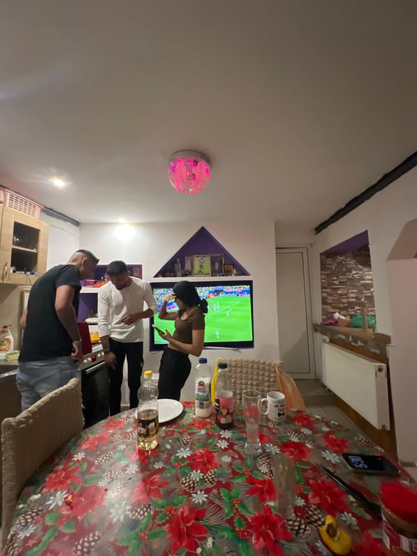 Relaxed home evening in Bulgaria: football, cooking, couch time.