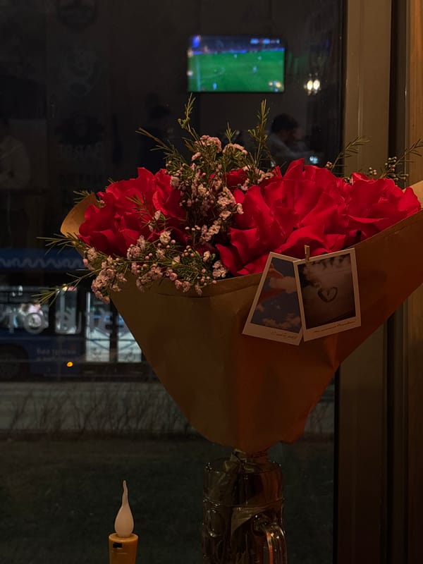 Red rose bouquet with Polaroid photos captured in Moscow