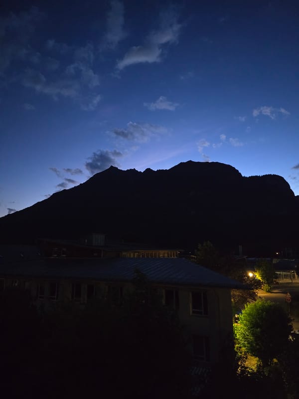 Dusk settles over Garmisch-Partenkirchen's Alpine rooftops