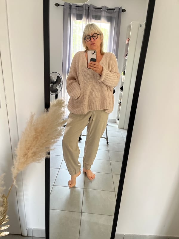 Woman takes mirror selfie in Chambœuf, France