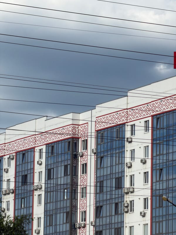Urban street-level snapshots: apartments, wires, and a hot tub on a trailer