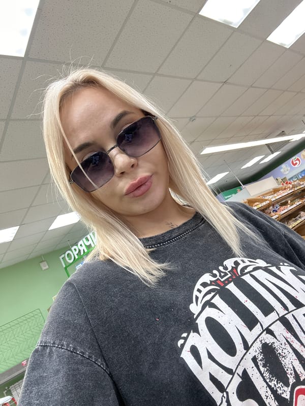 Woman documents shopping trip with selfies in Высокий, Russia
