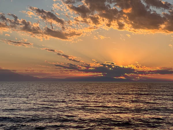 Golden sunset observed over waters near Nea Potidea, Greece