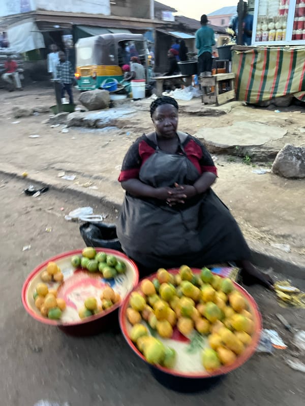 Crowd helps right overturned rickshaw in Jos street scene