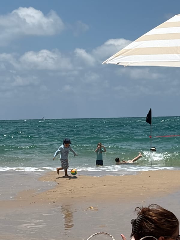 Summer morning on a Tel Aviv beach, waves and all.