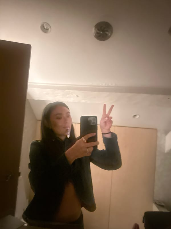 Person captures bathroom selfie, brushes teeth in Paris