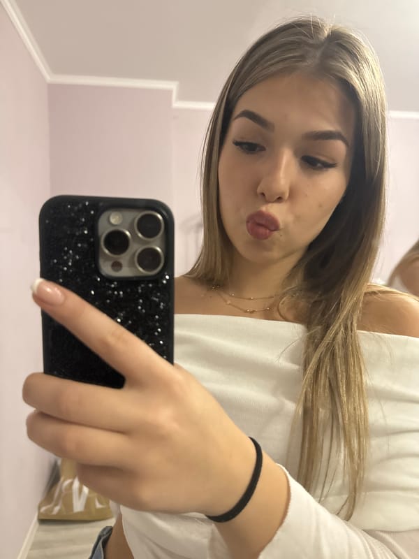 Woman takes selfies in interior space in Burgas