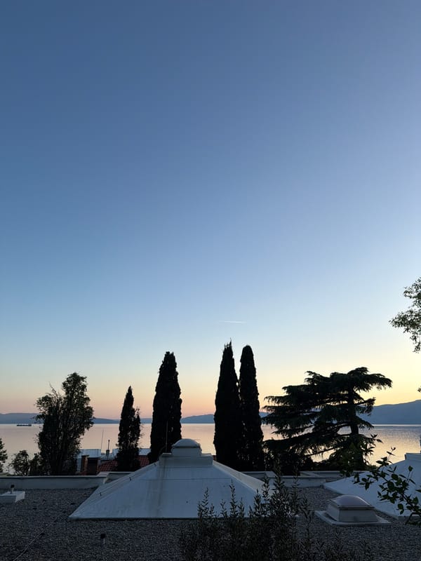 Two men enjoy clear weather on Rijeka beach