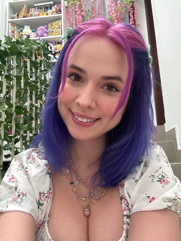 Woman takes colorful-haired selfies in Zagreb apartment
