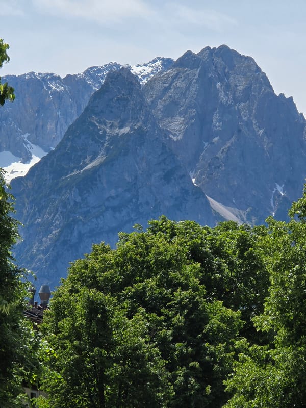 Alpine town scenes documented in Garmisch-Partenkirchen on sunny day