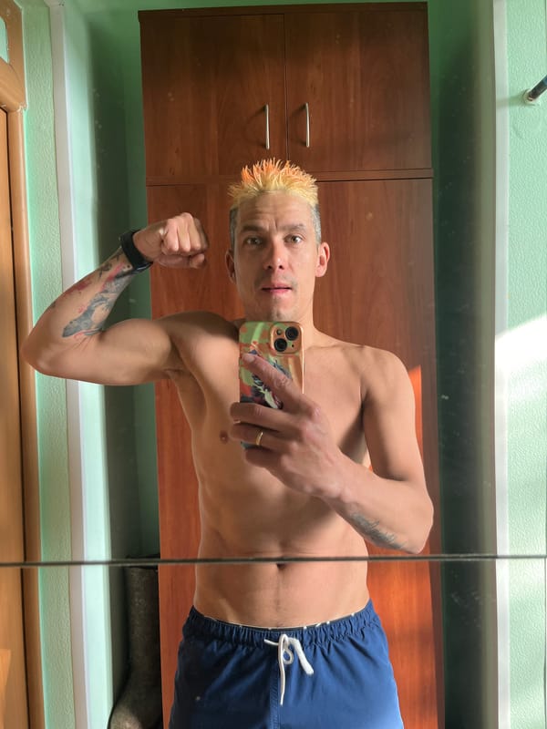 Man Takes Mirror Selfie While Flexing in Chaikovsky Bathroom