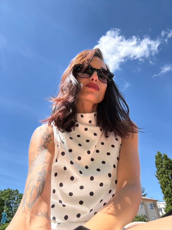 Woman photographs herself near fountain in Pleven, Bulgaria