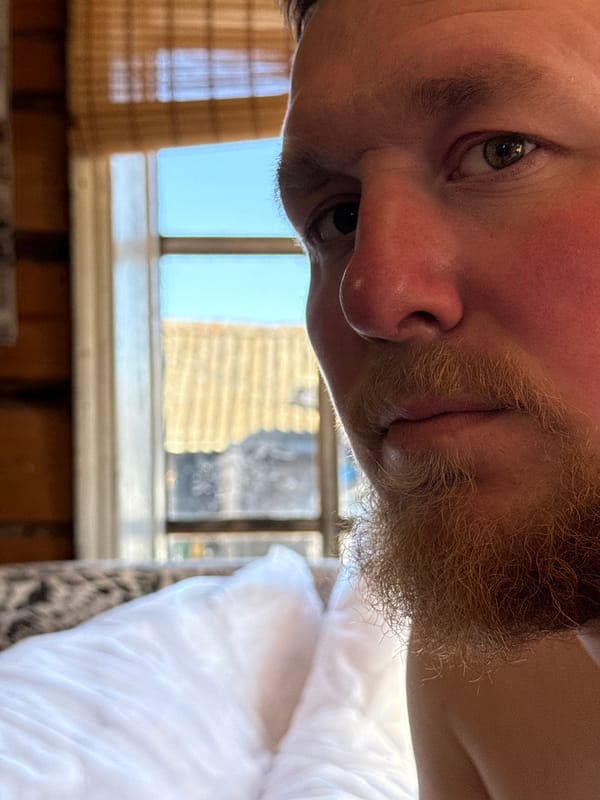 Home haircut session documented in rural Russian village