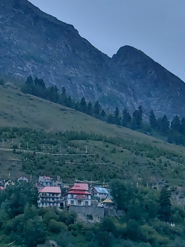 Keylong hillside town life, stupas, prayer flags, and mountain views
