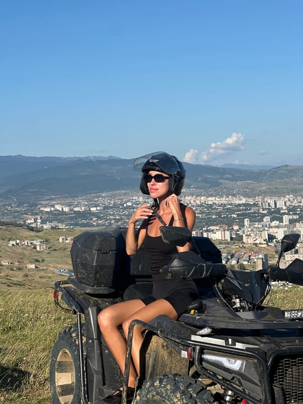 ATV stop on a Tbilisi hillside with city views below