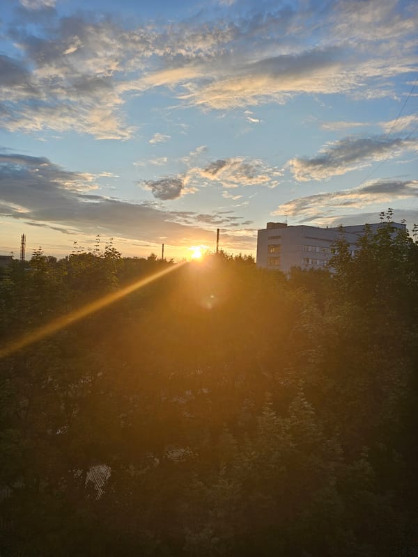 Golden sunset hangs low over Khimki's city skyline