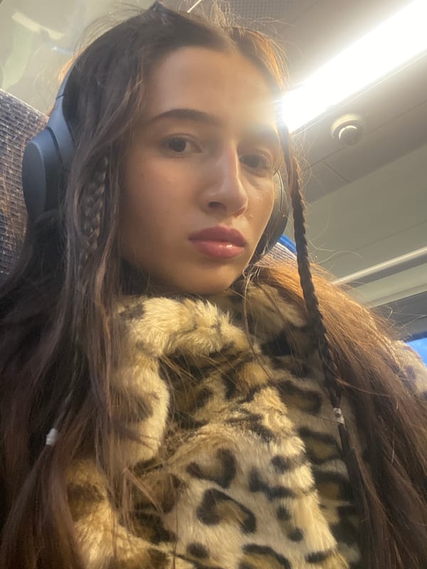 Person with headphones photographed on transport in Welwyn Hatfield