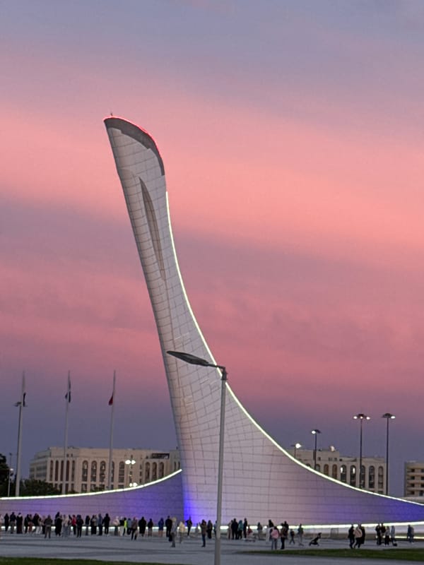 Evening gathering at Sochi Olympic Park draws visitors at sunset