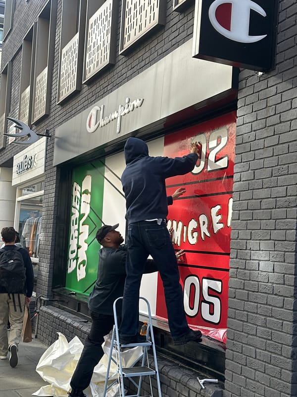 Workers Install Storefront Banner in London