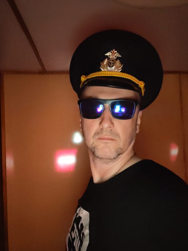 Man takes indoor selfies in Shcheleiki, Russia evening