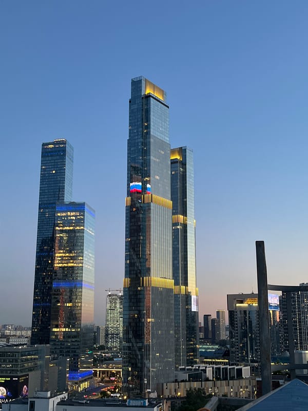 Moscow-City skyline at golden hour, glass towers at dusk