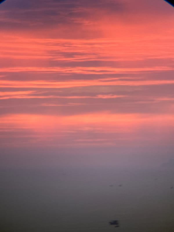 Nha Trang sunset watched from above, sky cycling through color