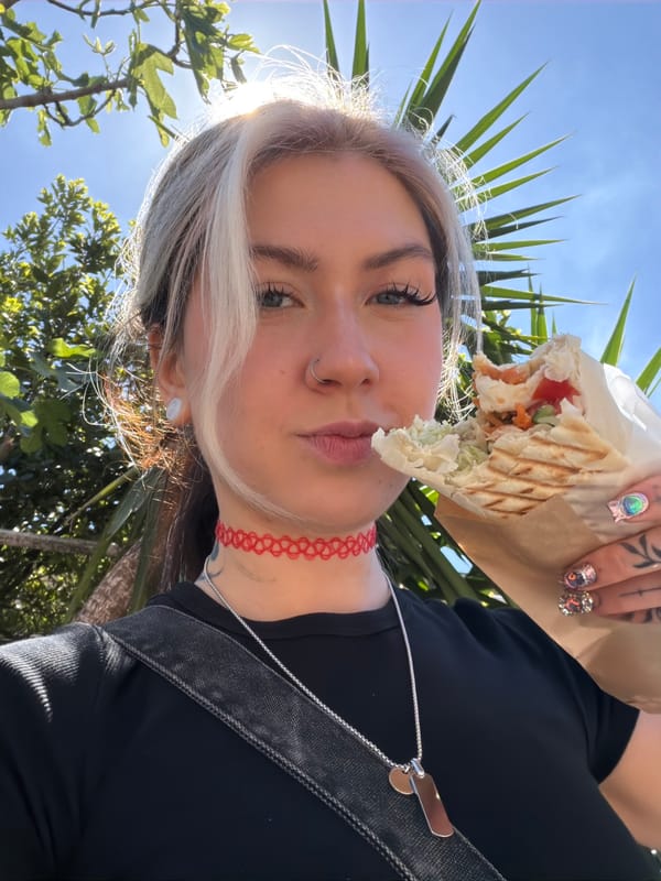 Woman enjoys shawarma lunch in Donji Pobori, Montenegro