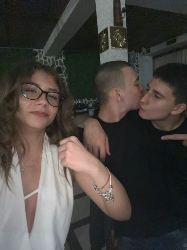 Three friends photographed together indoors in Karavelovo, Bulgaria