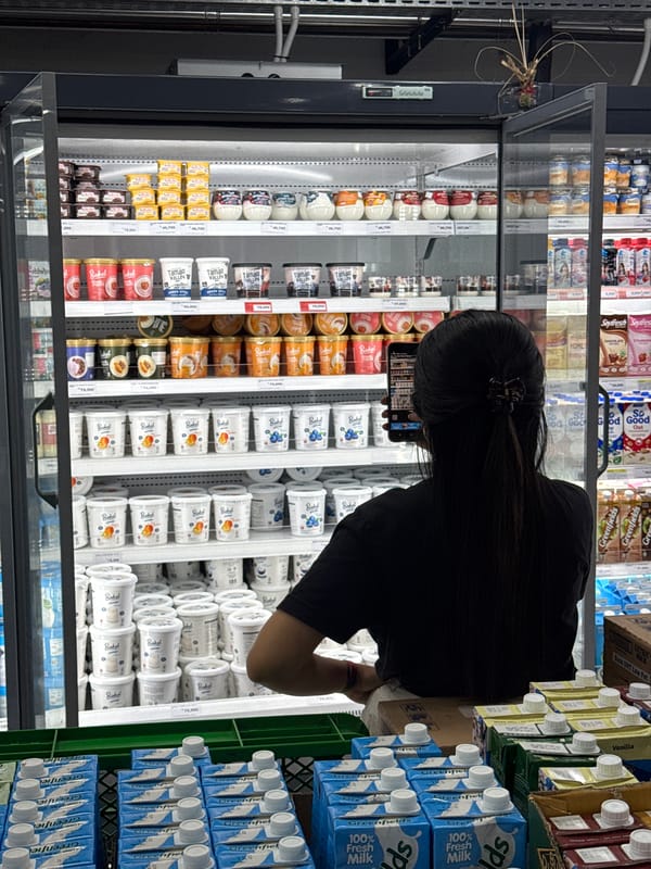 Woman shops dairy products at Petulu supermarket