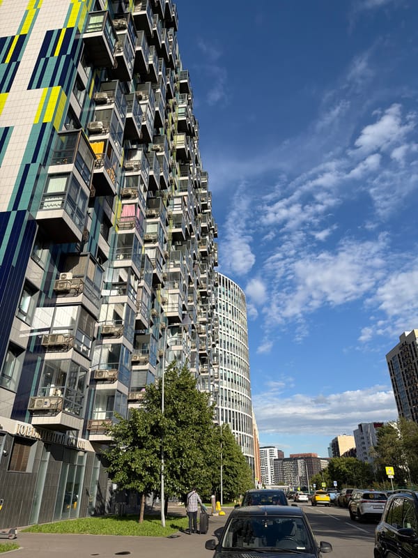 Moscow residential tower with glass-enclosed balconies and AC units