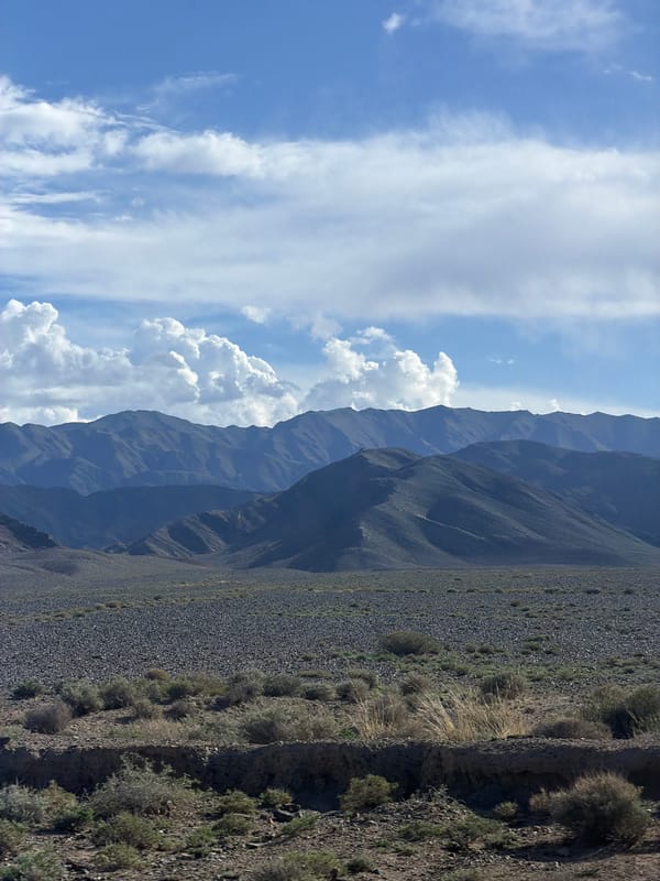 Mountainous landscape captured under cloudy skies in Kyrgyzstan