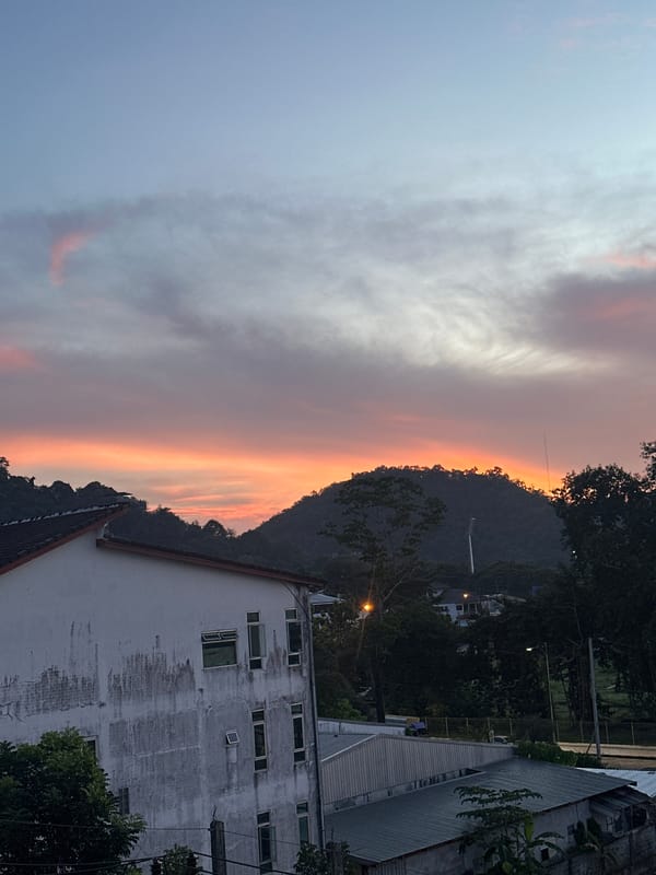Sunset over Wichit's hills and rooftops, Phuket