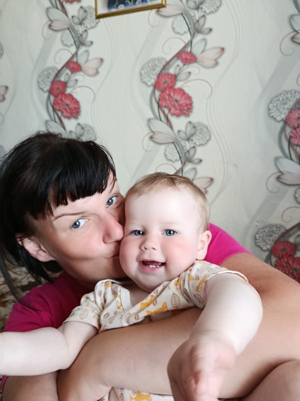 Tender moments: mother-child kiss, gentle water touch captured