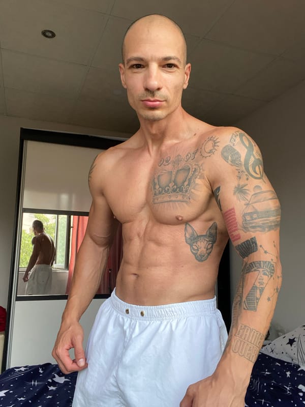 Tattooed figure, two looks, one room in Pleven