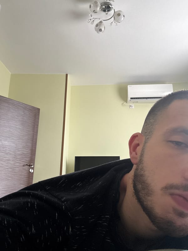 Person in hooded sweatshirt photographed indoors in Elhovo