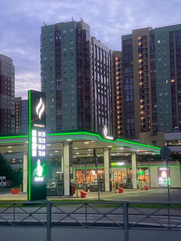 Auto dealership and city scenes at dusk, Russia