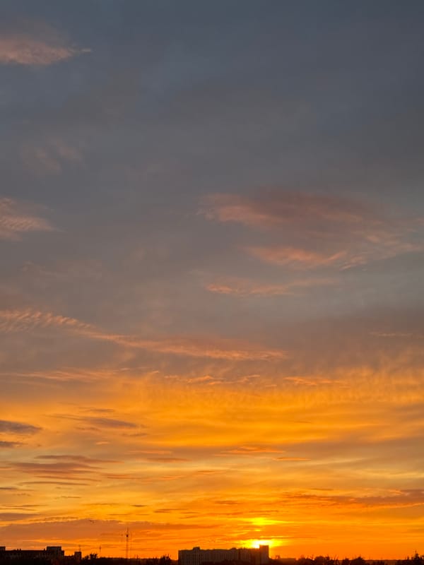 City sunset tracked across 90 minutes, clouds and color the whole way
