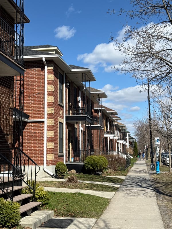 Man walks Montreal residential street, captured in multiple perspectives