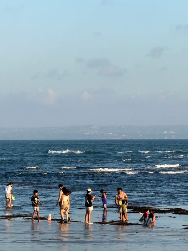 Sunset crowd fills North Kuta beach with soccer and shoreline life