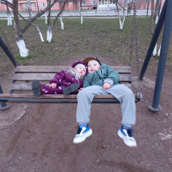 Children observed playing at residential playground during afternoon hours