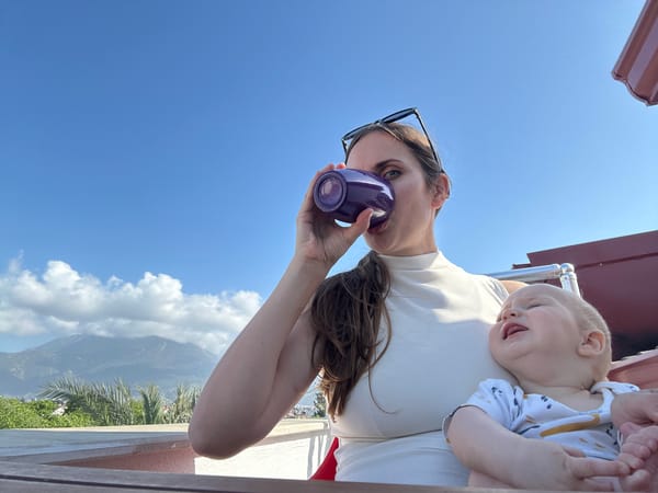 Children gather around infant on floor in Fethiye