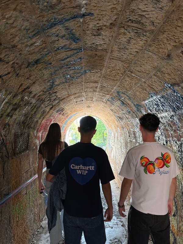 Tourist explores Rijeka coastal paths and tunnels on sunny afternoon