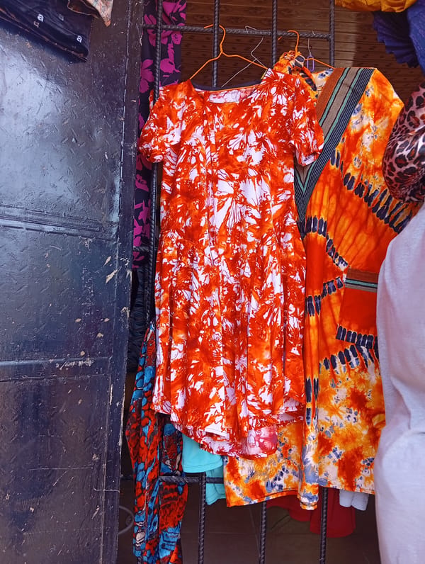 Street vendors display colorful clothing in Owerri, Nigeria