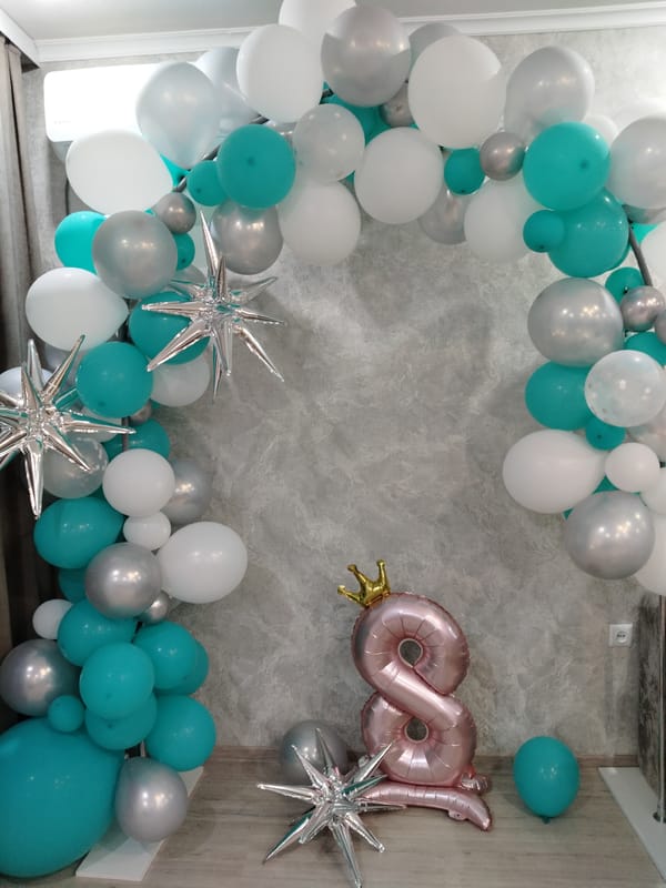 Flowers, balloons, and cats on a quiet celebratory evening