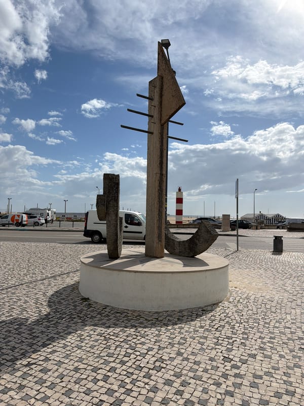 Child sits on boardwalk at Figueira da Foz beach