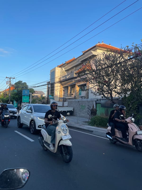 Denpasar street life: traffic, local shops, and city infrastructure