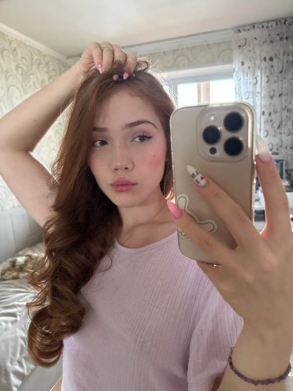 Woman takes mirror selfies in Naberezhnye Chelny apartment